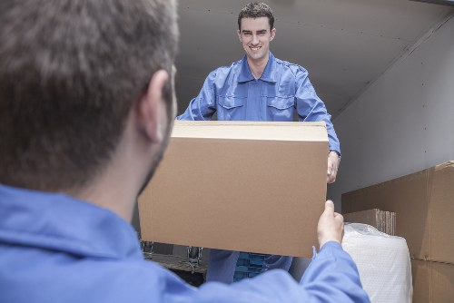 Professional team handling furniture pick-up in Maidavale Storage