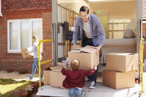 Professional packers organizing boxes in Maidavale Storage