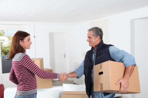 Experts packing office equipment for relocation